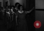 Standbild lange Schlange von uniformierten Zimmermädchen erhalten ihre Reinigungsgeräte United States USA, 1945, aus Sekunde 3 historischem Filmmaterial Videoclip 65675046827