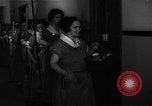 Standbild lange Schlange von uniformierten Zimmermädchen erhalten ihre Reinigungsgeräte United States USA, 1945, aus Sekunde 4 historischem Filmmaterial Videoclip 65675046827