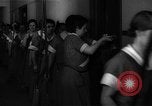 Standbild lange Schlange von uniformierten Zimmermädchen erhalten ihre Reinigungsgeräte United States USA, 1945, aus Sekunde 5 historischem Filmmaterial Videoclip 65675046827