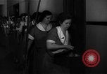 Standbild lange Schlange von uniformierten Zimmermädchen erhalten ihre Reinigungsgeräte United States USA, 1945, aus Sekunde 6 historischem Filmmaterial Videoclip 65675046827