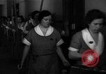 Standbild lange Schlange von uniformierten Zimmermädchen erhalten ihre Reinigungsgeräte United States USA, 1945, aus Sekunde 7 historischem Filmmaterial Videoclip 65675046827