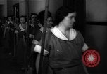 Standbild lange Schlange von uniformierten Zimmermädchen erhalten ihre Reinigungsgeräte United States USA, 1945, aus Sekunde 8 historischem Filmmaterial Videoclip 65675046827