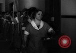 Standbild lange Schlange von uniformierten Zimmermädchen erhalten ihre Reinigungsgeräte United States USA, 1945, aus Sekunde 9 historischem Filmmaterial Videoclip 65675046827
