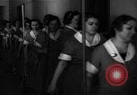 Standbild lange Schlange von uniformierten Zimmermädchen erhalten ihre Reinigungsgeräte United States USA, 1945, aus Sekunde 10 historischem Filmmaterial Videoclip 65675046827