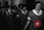 Standbild lange Schlange von uniformierten Zimmermädchen erhalten ihre Reinigungsgeräte United States USA, 1945, aus Sekunde 12 historischem Filmmaterial Videoclip 65675046827