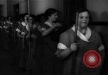 Standbild lange Schlange von uniformierten Zimmermädchen erhalten ihre Reinigungsgeräte United States USA, 1945, aus Sekunde 13 historischem Filmmaterial Videoclip 65675046827
