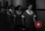Standbild lange Schlange von uniformierten Zimmermädchen erhalten ihre Reinigungsgeräte United States USA, 1945, aus Sekunde 14 historischem Filmmaterial Videoclip 65675046827