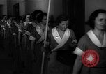 Standbild lange Schlange von uniformierten Zimmermädchen erhalten ihre Reinigungsgeräte United States USA, 1945, aus Sekunde 17 historischem Filmmaterial Videoclip 65675046827