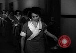 Standbild lange Schlange von uniformierten Zimmermädchen erhalten ihre Reinigungsgeräte United States USA, 1945, aus Sekunde 20 historischem Filmmaterial Videoclip 65675046827