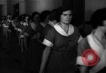 Standbild lange Schlange von uniformierten Zimmermädchen erhalten ihre Reinigungsgeräte United States USA, 1945, aus Sekunde 21 historischem Filmmaterial Videoclip 65675046827