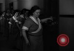 Standbild lange Schlange von uniformierten Zimmermädchen erhalten ihre Reinigungsgeräte United States USA, 1945, aus Sekunde 25 historischem Filmmaterial Videoclip 65675046827