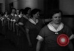 Standbild lange Schlange von uniformierten Zimmermädchen erhalten ihre Reinigungsgeräte United States USA, 1945, aus Sekunde 28 historischem Filmmaterial Videoclip 65675046827