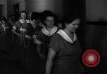 Standbild lange Schlange von uniformierten Zimmermädchen erhalten ihre Reinigungsgeräte United States USA, 1945, aus Sekunde 30 historischem Filmmaterial Videoclip 65675046827