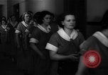 Standbild lange Schlange von uniformierten Zimmermädchen erhalten ihre Reinigungsgeräte United States USA, 1945, aus Sekunde 31 historischem Filmmaterial Videoclip 65675046827