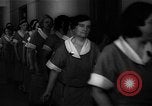 Standbild lange Schlange von uniformierten Zimmermädchen erhalten ihre Reinigungsgeräte United States USA, 1945, aus Sekunde 33 historischem Filmmaterial Videoclip 65675046827