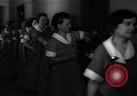 Standbild lange Schlange von uniformierten Zimmermädchen erhalten ihre Reinigungsgeräte United States USA, 1945, aus Sekunde 34 historischem Filmmaterial Videoclip 65675046827