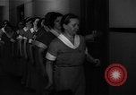 Standbild lange Schlange von uniformierten Zimmermädchen erhalten ihre Reinigungsgeräte United States USA, 1945, aus Sekunde 35 historischem Filmmaterial Videoclip 65675046827