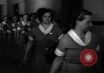 Standbild lange Schlange von uniformierten Zimmermädchen erhalten ihre Reinigungsgeräte United States USA, 1945, aus Sekunde 36 historischem Filmmaterial Videoclip 65675046827