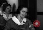 Standbild lange Schlange von uniformierten Zimmermädchen erhalten ihre Reinigungsgeräte United States USA, 1945, aus Sekunde 46 historischem Filmmaterial Videoclip 65675046827