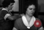 Standbild lange Schlange von uniformierten Zimmermädchen erhalten ihre Reinigungsgeräte United States USA, 1945, aus Sekunde 48 historischem Filmmaterial Videoclip 65675046827