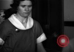 Standbild lange Schlange von uniformierten Zimmermädchen erhalten ihre Reinigungsgeräte United States USA, 1945, aus Sekunde 49 historischem Filmmaterial Videoclip 65675046827