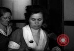 Standbild lange Schlange von uniformierten Zimmermädchen erhalten ihre Reinigungsgeräte United States USA, 1945, aus Sekunde 51 historischem Filmmaterial Videoclip 65675046827