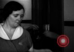 Standbild lange Schlange von uniformierten Zimmermädchen erhalten ihre Reinigungsgeräte United States USA, 1945, aus Sekunde 54 historischem Filmmaterial Videoclip 65675046827