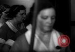 Standbild lange Schlange von uniformierten Zimmermädchen erhalten ihre Reinigungsgeräte United States USA, 1945, aus Sekunde 61 historischem Filmmaterial Videoclip 65675046827