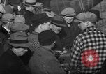 Image of sullen crowd views Canadian fishing boat Boston Massachusetts USA, 1935, second 10 stock footage video 65675046899