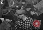Image of sullen crowd views Canadian fishing boat Boston Massachusetts USA, 1935, second 30 stock footage video 65675046899