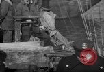 Image of sullen crowd views Canadian fishing boat Boston Massachusetts USA, 1935, second 34 stock footage video 65675046899