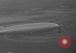 Image of Hindenburg and USS Los Angeles Zeppelins Lakehurst Naval Air Station New Jersey USA, 1936, second 24 stock footage video 65675047064