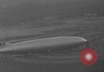 Image of Hindenburg and USS Los Angeles Zeppelins Lakehurst Naval Air Station New Jersey USA, 1936, second 25 stock footage video 65675047064
