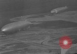 Image of Hindenburg and USS Los Angeles Zeppelins Lakehurst Naval Air Station New Jersey USA, 1936, second 58 stock footage video 65675047064