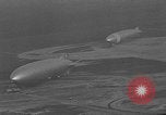 Image of Hindenburg and USS Los Angeles Zeppelins Lakehurst Naval Air Station New Jersey USA, 1936, second 60 stock footage video 65675047064