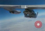 Image of X-24 lifting body aircraft suspended beneath wing of B-52 aircraft California United States USA, 1970, second 56 stock footage video 65675047491