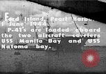 Standbild P-47 Thunderbolts geladen auf Flugzeugträger Ford Island Pearl Harbor Hawaii USA, 1944, aus Sekunde 1 historischem Filmmaterial Videoclip 65675047534