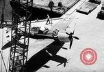 Standbild P-47 Thunderbolts geladen auf Flugzeugträger Ford Island Pearl Harbor Hawaii USA, 1944, aus Sekunde 46 historischem Filmmaterial Videoclip 65675047534