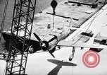 Standbild P-47 Thunderbolts geladen auf Flugzeugträger Ford Island Pearl Harbor Hawaii USA, 1944, aus Sekunde 58 historischem Filmmaterial Videoclip 65675047534