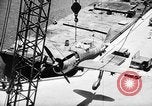Standbild P-47 Thunderbolts geladen auf Flugzeugträger Ford Island Pearl Harbor Hawaii USA, 1944, aus Sekunde 59 historischem Filmmaterial Videoclip 65675047534