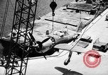 Standbild P-47 Thunderbolts geladen auf Flugzeugträger Ford Island Pearl Harbor Hawaii USA, 1944, aus Sekunde 60 historischem Filmmaterial Videoclip 65675047534