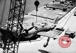 Standbild P-47 Thunderbolts geladen auf Flugzeugträger Ford Island Pearl Harbor Hawaii USA, 1944, aus Sekunde 61 historischem Filmmaterial Videoclip 65675047534