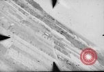 Standbild P-47s 19 Fighter Squadron Angriff japanische Stellungen Insel Tinian Marianen, 1944, aus Sekunde 62 historischem Filmmaterial Videoclip 65675047548