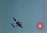 Image of P-38 and P-47 aircraft peel off  and a P-47 lands Belgium, 1945, second 3 stock footage video 65675047648