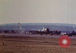 Image of P-38 and P-47 aircraft peel off  and a P-47 lands Belgium, 1945, second 19 stock footage video 65675047648