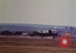 Image of P-38 and P-47 aircraft peel off  and a P-47 lands Belgium, 1945, second 20 stock footage video 65675047648
