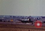 Image of P-38 and P-47 aircraft peel off  and a P-47 lands Belgium, 1945, second 21 stock footage video 65675047648