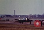 Image of P-38 and P-47 aircraft peel off  and a P-47 lands Belgium, 1945, second 22 stock footage video 65675047648