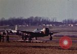 Image of P-38 and P-47 aircraft peel off  and a P-47 lands Belgium, 1945, second 23 stock footage video 65675047648