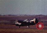 Image of P-38 and P-47 aircraft peel off  and a P-47 lands Belgium, 1945, second 25 stock footage video 65675047648